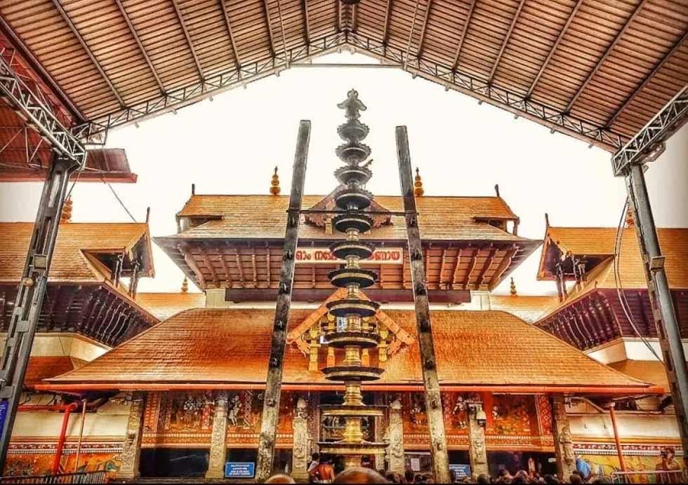 The gold-plated dhwajasthambham inside Guruvayur Temple
